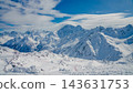 Snow-covered Mount Elbrus and surrounding Caucasus peaks under blue sky panoramic winter landscape 143631753
