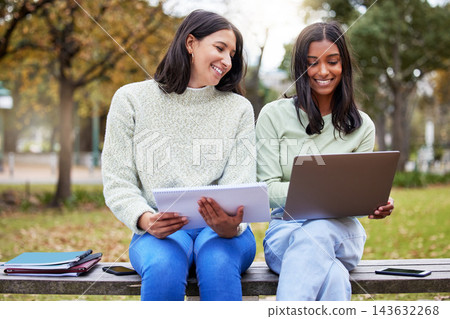 Students, laptop and friends in a park with learning, research and exam info on campus. Happy, school and university women with notes, online and college test with a computer outdoor on garden bench Students, laptop and friends in a park with learning, research and exam info on campus. Happy, school and university women with notes, online and college test with a computer outdoor on garden bench 143632268