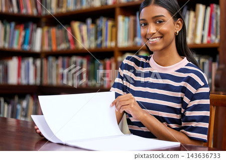 University student, portrait and library for research project or course education, learning or campus. Indian woman, face and college development or future scholarship with reading, study or academic University student, portrait and library for research project or course education, learning or campus. Indian woman, face and college development or future scholarship with reading, study or academic 143636733