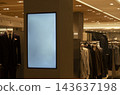Vertical Display Screen Signage Poster Mockup on Pillar in Men Store Interior 143637198