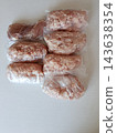 Ground meat and pork loin portions packaged in plastic bags, ready for freezing and meal prepping, showing raw minced meat and raw pork for cooking meals 143638354
