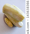 Peeled zucchini squash ready for cooking, preparing fresh vegetable ingredients for a healthy meal, raw organic produce on a kitchen counter 143638366