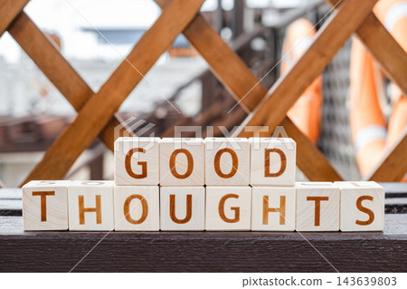 motivational word Good thoughts, from letters on wooden cubes motivational word Good thoughts, from letters on wooden cubes 143639803