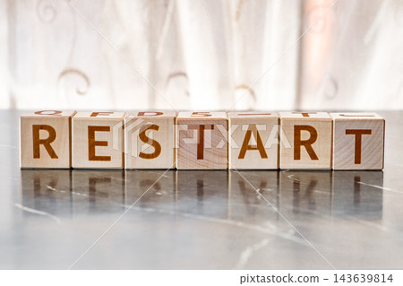 motivational word Restart, from letters on wooden cubes motivational word Restart, from letters on wooden cubes 143639814