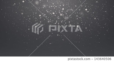 White particles falling on a dark background creating a shimmering light effect 143640506