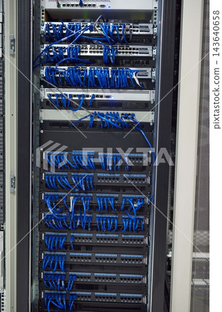 Data center, cables and hardware in server room for information technology, configuration or software update. Empty, hub and wiring for security patch, system recovery or optimize performance Data center, cables and hardware in server room for information technology, configuration or software update. Empty, hub and wiring for security patch, system recovery or optimize performance 143640658