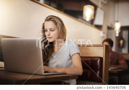 Woman, serious and research at cafe with laptop as university student for elearning or online education. Female learner, studying and revision with distance leaning for college exams and project Woman, serious and research at cafe with laptop as university student for elearning or online education. Female learner, studying and revision with distance leaning for college exams and project 143640706