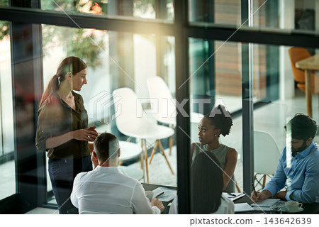 Boardroom, speaker and woman in presentation, talking and group of colleagues, listening and together. Workshop, training and employees in business, journalist and notes for meeting or collaboration Boardroom, speaker and woman in presentation, talking and group of colleagues, listening and together. Workshop, training and employees in business, journalist and notes for meeting or collaboration 143642639
