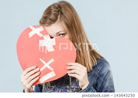 Young woman with broken heart Young woman with broken heart 143643250