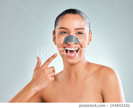 Woman, beauty and blackhead remover for skincare, dermatology and wellness in studio with healthy skin. Girl, happiness and nose strip for cosmetics, spa and facial mask on white background in France 143643282