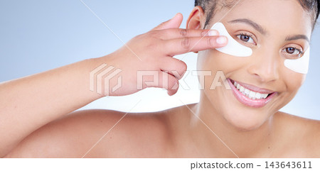 Beauty, eye mask and portrait of happy woman in studio on blue background for wellness. Cosmetics, face and smile with natural model at spa for aesthetic antiaging or cosmetology treatment banner Beauty, eye mask and portrait of happy woman in studio on blue background for wellness. Cosmetics, face and smile with natural model at spa for aesthetic antiaging or cosmetology treatment banner 143643611