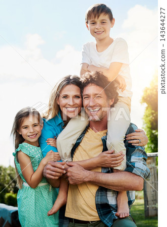 Family, portrait and smile with piggyback at park for weekend adventure, bonding and support. Summer, love and children with parents in nature for holiday, vacation and happiness on fathers day 143644277