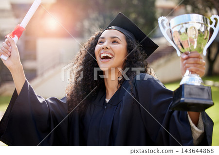 Happy, woman and student with trophy and diploma for graduation celebration and outdoor ceremony. Excited, female person and smile for victory, achievement and success with degree certificate at uni 143644868