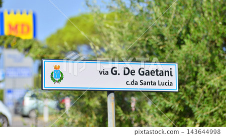 Cefalu, Italy. 22 August 2026. Urban landscape. Neon sign with the inscription: Via G, De Gaetani c da Santa Lucia  143644998