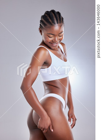 Black woman, smile and butt in studio for underwear, wellness and beauty model aesthetic. Girl, happy and ass for lingerie, transformation or fitness with natural body confidence on white background Black woman, smile and butt in studio for underwear, wellness and beauty model aesthetic. Girl, happy and ass for lingerie, transformation or fitness with natural body confidence on white background 143646000