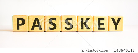 Passkey word symbol. Concept word Passkey on beautiful wooden blocks. Beautiful white table white background. Business passkey word concept. Copy space. Passkey word symbol. Concept word Passkey on beautiful wooden blocks. Beautiful white table white background. Business passkey word concept. Copy space. 143646115
