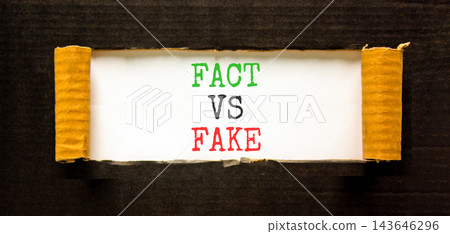 Fact vs versus fake words symbol. Concept words Fact vs Fake on beautiful white paper. Beautiful black background. Business and fact vs versus fake concept. Copy space. Fact vs versus fake words symbol. Concept words Fact vs Fake on beautiful white paper. Beautiful black background. Business and fact vs versus fake concept. Copy space. 143646296