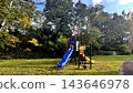 Playground equipment in a deserted park with no one around 143646978