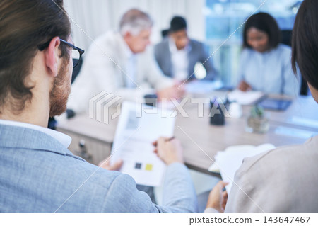 Back, business man and documents for presentation, seminar and workshop at desk in office. Teamwork, collaboration and trade show or meeting in conference room for international company in New York 143647467