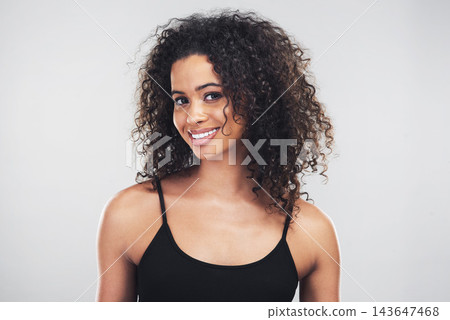 Woman, happy and hair care in studio with portrait for salon treatment, shampoo and satisfaction. Person, smile and confident with pride for healthy, shine and curly hairstyle on white background Woman, happy and hair care in studio with portrait for salon treatment, shampoo and satisfaction. Person, smile and confident with pride for healthy, shine and curly hairstyle on white background 143647468