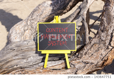 Content management system symbol. Concept words Content management system on beautiful blackboard. Beautiful old tree background. Business content management system concept. Copy space. Content management system symbol. Concept words Content management system on beautiful blackboard. Beautiful old tree background. Business content management system concept. Copy space. 143647751