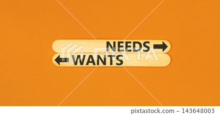 Needs instead wants words symbol. Concept words Needs Wants on beautiful wooden sticks. Beautiful orange background. Business psychology needs or wants concept. Copy space. Needs instead wants words symbol. Concept words Needs Wants on beautiful wooden sticks. Beautiful orange background. Business psychology needs or wants concept. Copy space. 143648003
