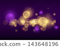 Abstract shimmering light particles floating on a dark purple backdrop 143648196