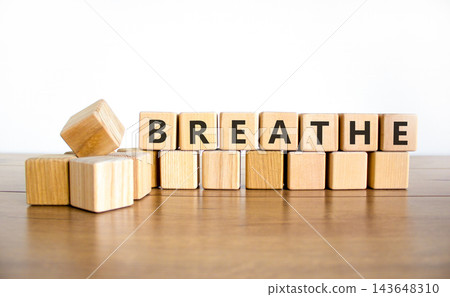 Breathe word symbol. Concept word Breathe on beautiful wooden blocks. Beautiful wooden table white background. Business medical breathe word concept. Copy space. 143648310