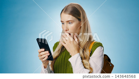 Travel scam, phone and text with shocked woman and fake news from phishing and reading spam in studio. Social media, confused and problem with online notification and holiday app with issue on mobile Travel scam, phone and text with shocked woman and fake news from phishing and reading spam in studio. Social media, confused and problem with online notification and holiday app with issue on mobile 143648568