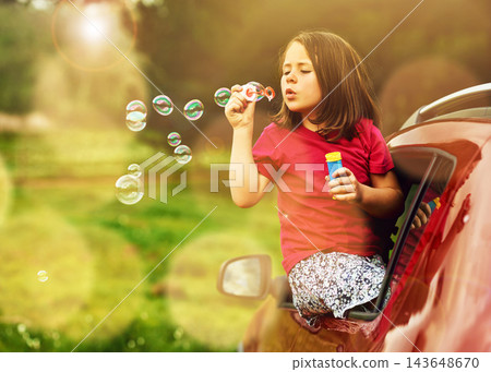 Blowing, bubbles and girl for fun in countryside by window, outdoor or nature in Australia. Child, kid and game in car for playing, freedom and childhood development for learning with soap toys Blowing, bubbles and girl for fun in countryside by window, outdoor or nature in Australia. Child, kid and game in car for playing, freedom and childhood development for learning with soap toys 143648670