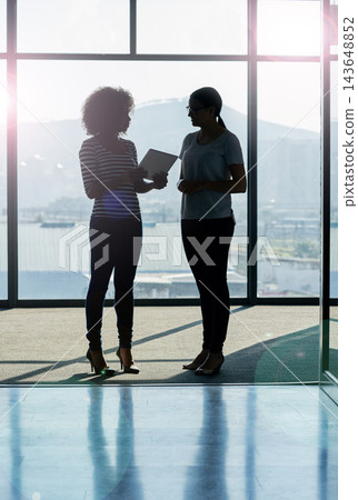 Tablet, women and conversation in office on silhouette for strategy, planning and company growth. People, discussion and collaboration with help or update as copy writer for partnership and teamwork Tablet, women and conversation in office on silhouette for strategy, planning and company growth. People, discussion and collaboration with help or update as copy writer for partnership and teamwork 143648852
