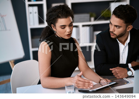 Corporate conversation, man and woman with tablet for business strategy, project management and support by desk. Office staff, digital tech and brainstorming meeting for sharing idea and cooperation 143649094