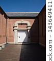 Landscape with red brick warehouse and blue sky 143649411