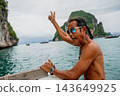 Thai boatman showing peace sign in phang nga bay 143649925