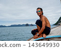 Thai man traveling on traditional longtail boat in thailand 143649930
