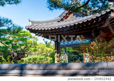 Traditional Korean Hanok Houses and Tiled Roofs against Bukhansan Mountain in Eunpyeong Hanok Village, Seoul Traditional Korean Hanok Houses and Tiled Roofs against Bukhansan Mountain in Eunpyeong Hanok Village, Seoul 143652442