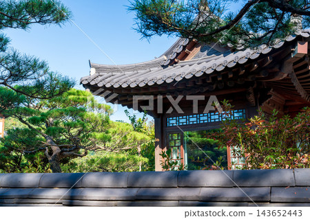 Traditional Korean Hanok Houses and Tiled Roofs against Bukhansan Mountain in Eunpyeong Hanok Village, Seoul Traditional Korean Hanok Houses and Tiled Roofs against Bukhansan Mountain in Eunpyeong Hanok Village, Seoul 143652443