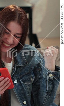 Vertical video. Woman recording answering by audio message in social network on mobile phone. Young woman call on phone closeup, use loudspeaker at home. Vertical video. Woman recording answering by audio message in social network on mobile phone. Young woman call on phone closeup, use loudspeaker at home. 143652753