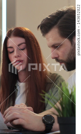 Vertical video. Man and woman with paperwork, inflation and frustrated with financial review and problem. Couple stressing about budget, savings and finance. Vertical video. Man and woman with paperwork, inflation and frustrated with financial review and problem. Couple stressing about budget, savings and finance. 143652822