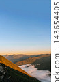 Sunrise Over Mountain Valley Filled with Fog 143654405