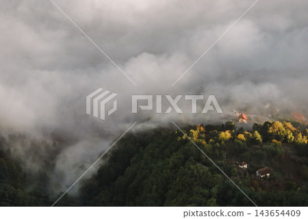 Aerial View of Mountain Village in Morning Fog Aerial View of Mountain Village in Morning Fog 143654409