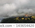 Sunlight Illuminating Foggy Mountain Village 143654420