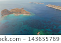 High angle panoramic drone view of famous Balos beach lagoon with turquoise sea water and Gramvousa island cape on Crete island in Greece 143655769