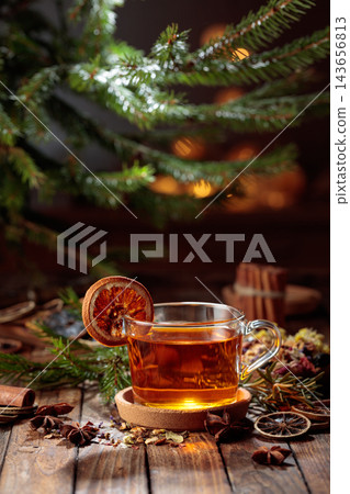 Christmas herbal tea with cinnamon, anise, and dried citrus slices. Christmas herbal tea with cinnamon, anise, and dried citrus slices. 143656813