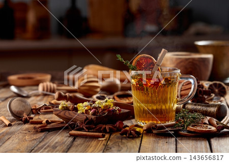 Herbal tea with thyme and dried orange slice. Herbal tea with thyme and dried orange slice. 143656817