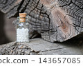 Homeopathic remedy in glass vial with sugar globules, natural medicine concept. 143657085