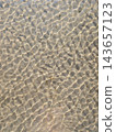 Natural texture background of sand ripples under transparent shallow sea water 143657123