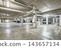 Modern empty underground parking garage interior and concrete columns 143657134
