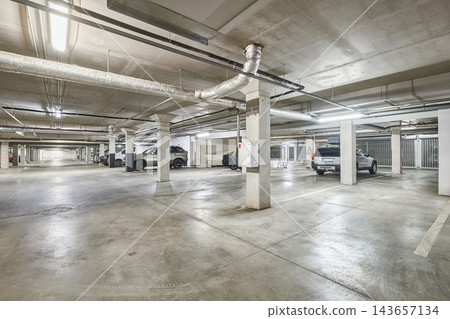 Modern empty underground parking garage interior and concrete columns Modern empty underground parking garage interior and concrete columns 143657134