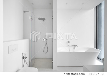 Modern empty bathroom interior mockup with white bathtub, glass shower cabin, and toilet. Modern empty bathroom interior mockup with white bathtub, glass shower cabin, and toilet. 143657136
